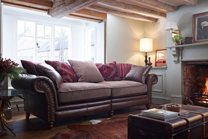 Leather sofa with outlet fabric cushions